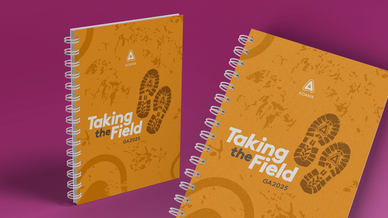 Take The Field, Pafos 2025: dois cadernos espiralados laranja com a identidade do evento